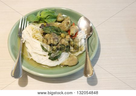 Curry chicken noodles (KHANOM CHIN) with vegetable.