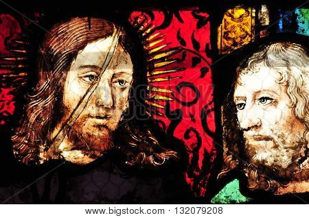 Triel sur Seine France - april 3 2016 : the Christ on historical stained glass window in Saint Martin church