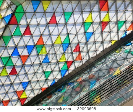 Abstract close-up view of modern glazing with colorful triangles 3d illustration