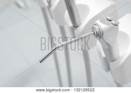 Different dental instruments and tools in a dentists office specialized equipment to treat all types of dental diseases in the office.