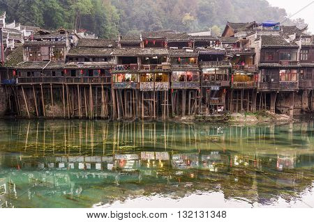 Wooden Houses Along River