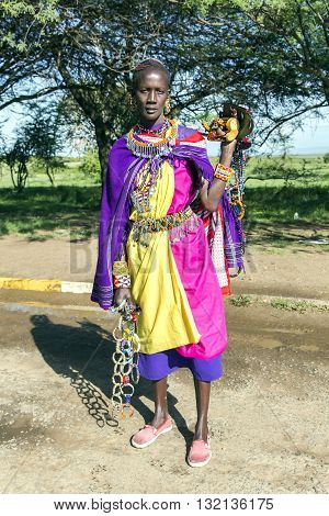 AFRICA, TANZANIA, MAY, 06, 2016 - African woman of the Masai tribe sells ornaments made of beads. The Maasai (also called Masai) are an indigenous African ethnic group of semi-nomadic people located in Kenya and northern Tanzania.