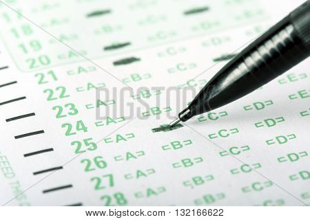 An answer sheet or optical mark recognition sheet with a mechanical pencil.