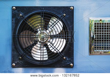 Axial cooling fan blower in garage, close up