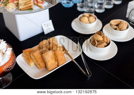 Homemade cookies with sesame seeds. Tongs dessert. Breakfast cookie. Dessert cookies. Cookies. Cookie. Tea cup