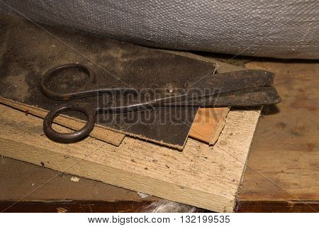 Old scissors on the table brown rustic
