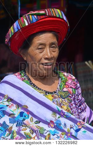 SANTIAGO DE ATITLAN GUATEMALA APRIL 29 2016: Tzutujil woman show to wearing a traditional toyocal hat. The Mayan people still make up a majority of the population in Guatemala,