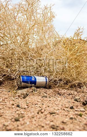 Sharm El Sheikh Egypt - May 07 2014: Empty cans of Red Bull in the dry desert