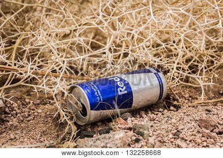 Sharm El Sheikh Egypt - May 07 2014: Empty cans of Red Bull in the dry desert