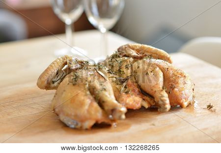 Cooked spatchcock (butterfly) chicken with herb crust