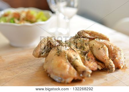 Cooked spatchcock (butterfly) chicken with herb crust