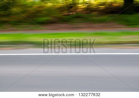 View from the window of a car for a motion blur on the road