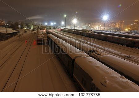 Railway In Winter Night And White Snow