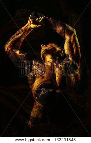 Handsome young flexible man with sexy bare muscular torso combined with textured painted old wall peelling off double exposure