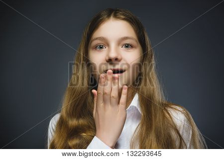 Closeup Portrait of happy girl going surprise isolated on gray background.