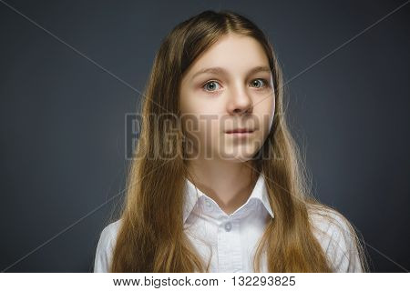 Closeup Portrait of happy girl going surprise isolated on gray background.