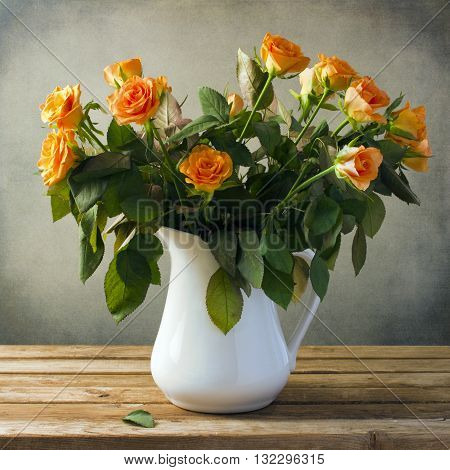 Beautiful rose flower bouquet on wooden table