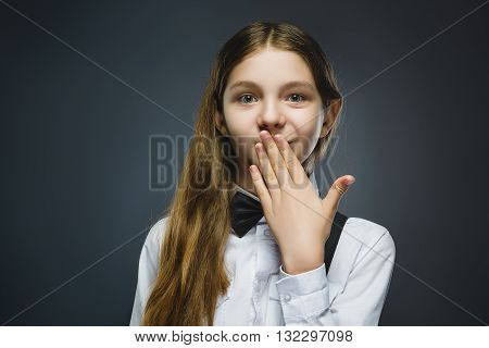Closeup Portrait of wondering girl going surprise on gray background.