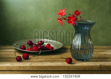 Still life with peregrina flowers and cherries
