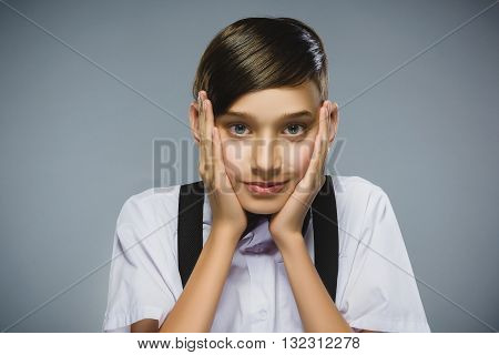 Closeup Portrait of happy boy going surprise isolated on gray background.