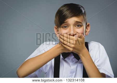 Closeup Portrait of happy boy going surprise isolated on gray background.