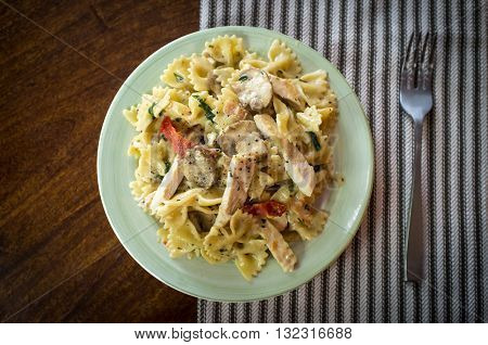 Chicken farfalle alfredo with mushrooms and sundried tomatoes