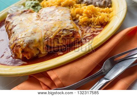 Authentic Mexican chimichanga burrito with sour cream jalapeno and cilantro