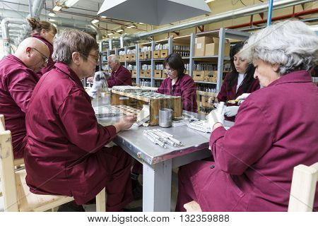 Workers At An Assembly Line In Munition Factory