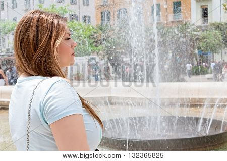 a blond woman near fountain in Campobasso