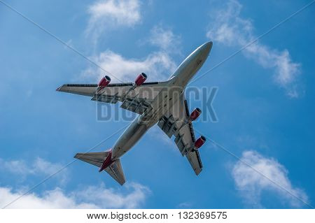 MANCHESTER, UNITED KINGDOM - May 30, 2016: Emirates Airbus A380 underside view. Manchester Airport May 30 2016.