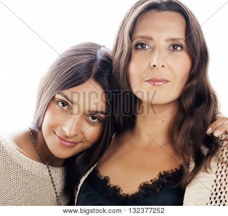 cute pretty teen daughter with mature mother hugging, fashion style brunette makeup close up tann s, warm colors lifestyle people concept