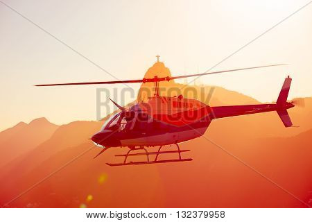 helicopter flying over Rio de Janeiro at the evening light