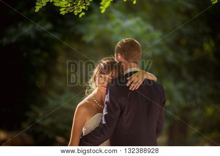 Bride and groom on their wedding day In garden