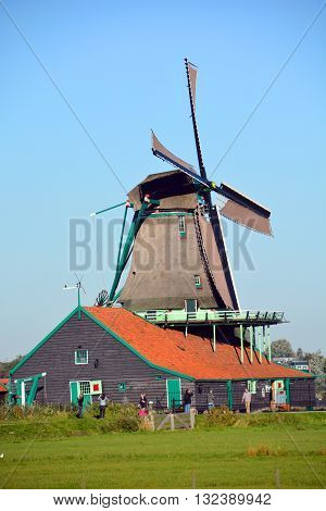 ZAANSE SCHANS NETHERLAND OCTOBER 01 2015: Zaanse Schans is a neighbourhood of Zaandam in the municipality of Zaanstad in the Netherlands. It has a collection of well-preserved historic windmills