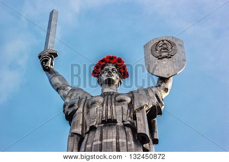 KIEV, UKRAINE - MAY 09: The Motherland Monument also known as Rodina-Mat', decorated with red poppy flower wreath on Victory Day, devoted the Great Patriotic War. May 09, 2016 in Kiev, Ukraine