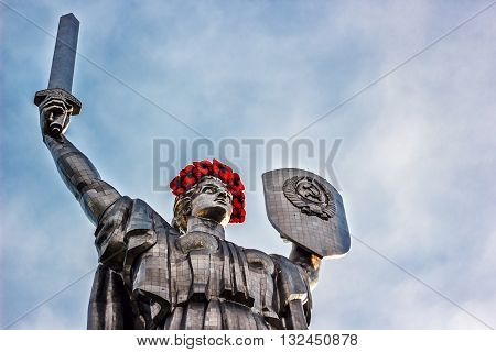 KIEV, UKRAINE - MAY 09: The Motherland Monument also known as Rodina-Mat', decorated with red poppy flower wreath on Victory Day, devoted the Great Patriotic War. May 09, 2016 in Kiev, Ukraine
