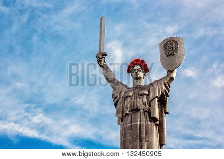 KIEV, UKRAINE - MAY 09: The Motherland Monument also known as Rodina-Mat', decorated with red poppy flower wreath on Victory Day, devoted the Great Patriotic War. May 09, 2016 in Kiev, Ukraine