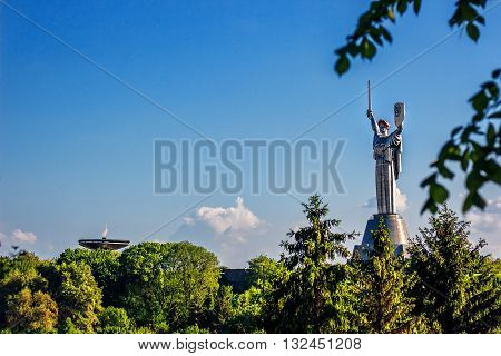 KIEV, UKRAINE - MAY 09: The Motherland Monument also known as Rodina-Mat', decorated with red poppy flower wreath on Victory Day, devoted the Great Patriotic War. May 09, 2016 in Kiev, Ukraine