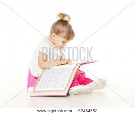 Pretty little girl  with a book sits on a pink baby potty on a white background.