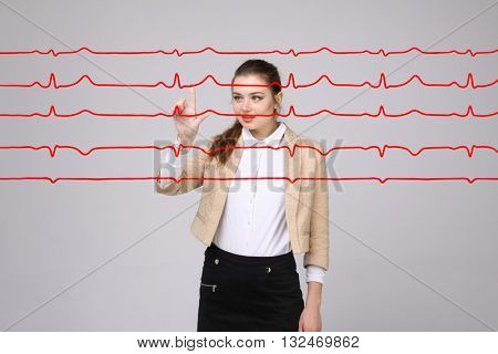 Doctor woman working with cardiogram lines