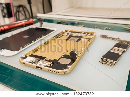Repairing Smart Phone on Desk Selective Focus