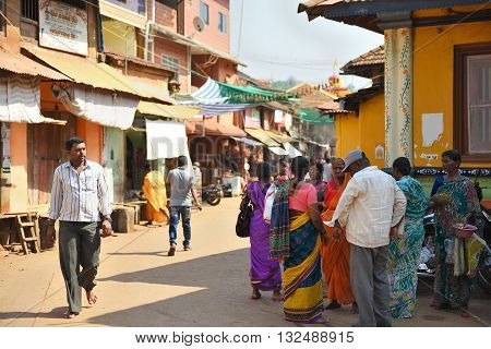 GOKARNA KARNATAKA INDIA - JANUARY 29 2016: Indian people comunicating in the street in Gokarna city
