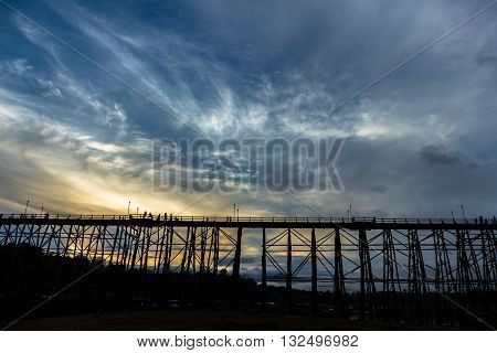 Black silhouette of the wooden bridge in Kanjanaburi province, Thailand