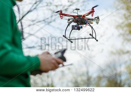 Man controling a drone.