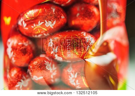 KILCHBERG SWITZERLAND - MARCH 20 2014: Lindt Lindor chocolate truffle easter egg chocolate. Lindt is one one of the lastgest luxury chocolate and confectionery company worldwide with more than 30 factories worldwide