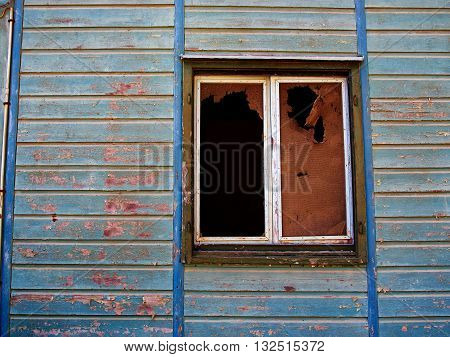 Details of an old weathered abandoned western colonial style wooden house shed