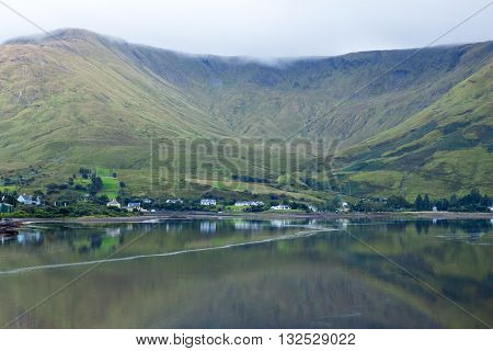 A view of Leenane Village, Connemara, Co. Galway, Ireland across Killary Fjord.