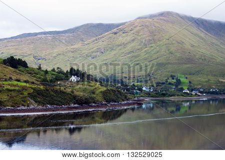 A view of Leenane Village, Connemara, Co. Galway, Ireland across Killary Fjord.
