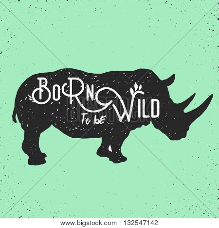 hand drawn silhouette of mighty wild rhino and motivation quote on it