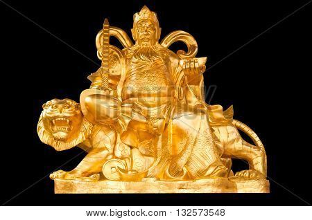 Golden Chinese Prosperity Money God sit on a tiger isolate on black background with clipping path